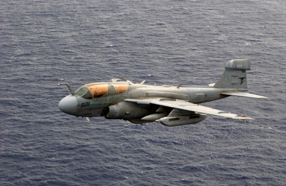031026-N-6536T-009 Western Pacific Ocean (Oct. 26, 2003) -- An EA-6B Prowler assigned to the ÒBlack RavensÓ of Electronic Attack Squadron One Thirty Five (VAQ-135) flies over the Western Pacific Ocean during flight operations off of USS Nimitz (CVN 68). The Nimitz Carrier Strike Group and Carrier Air Wing Eleven (CVW-11) are deployed to the Western Pacific. U.S. Navy photo by PhotographerÕs Mate 3rd Class Elizabeth Thompson. (RELEASED)