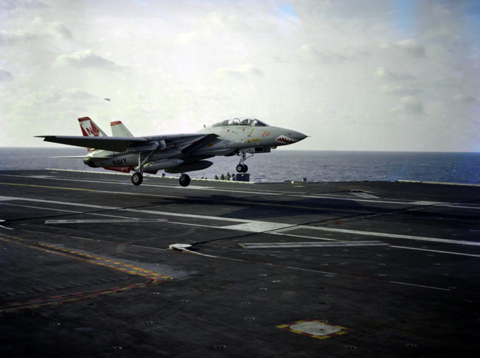 A US Navy (USN) F-14A Tomcat, Fighter Squadron 111 (VF-111), Sundowners, Naval Air Station (NAS) Miramar, California (CA), makes the first landing on the deck of the USN Nimitz Class Aircraft Carrier USS CARL VINSON (CVN 70) by Carrier Air Wing 15 (CVW-15).