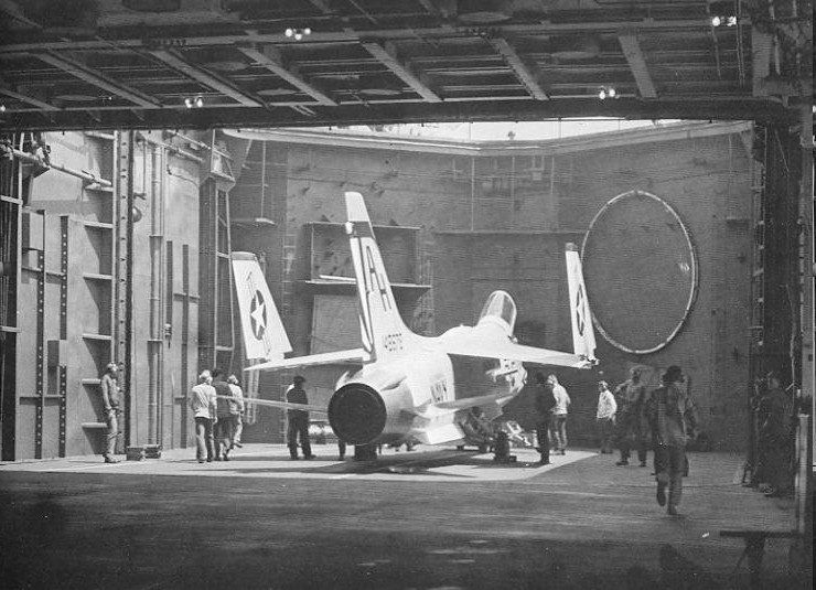An F-8H Crusader (BuNo 148678) of VF-111 Sundowners, Attack Carrier Air Wing Sixteen (CVW-16), on the forward elevator of the aircraft carrier USS Ticonderoga (CVA-14) in 1969 during a deployment to Vietnam