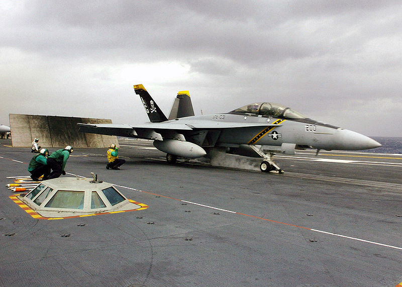A US Navy F/A-18F Super Hornet aircraft assigned to the "Jolly Rogers" of Strike Fighter Squadron 103 (VFA-103), prepares to launch from the flight deck of the Nimitz-class Aircraft Carrier USS Dwight D. Eisenhower, 2006.