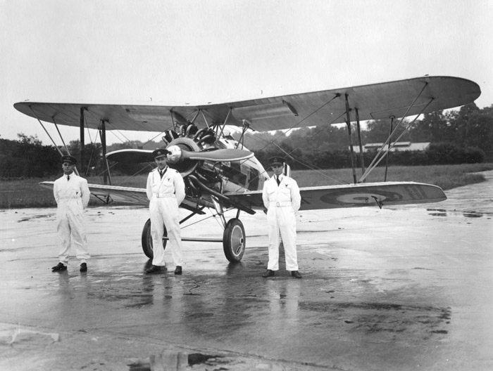 Bader, Fl.Lt. Harry Day and Fl.Off. Geoffrey Stephenson during training for the 1932 Hendon airshow, with a Gloster Gamecock