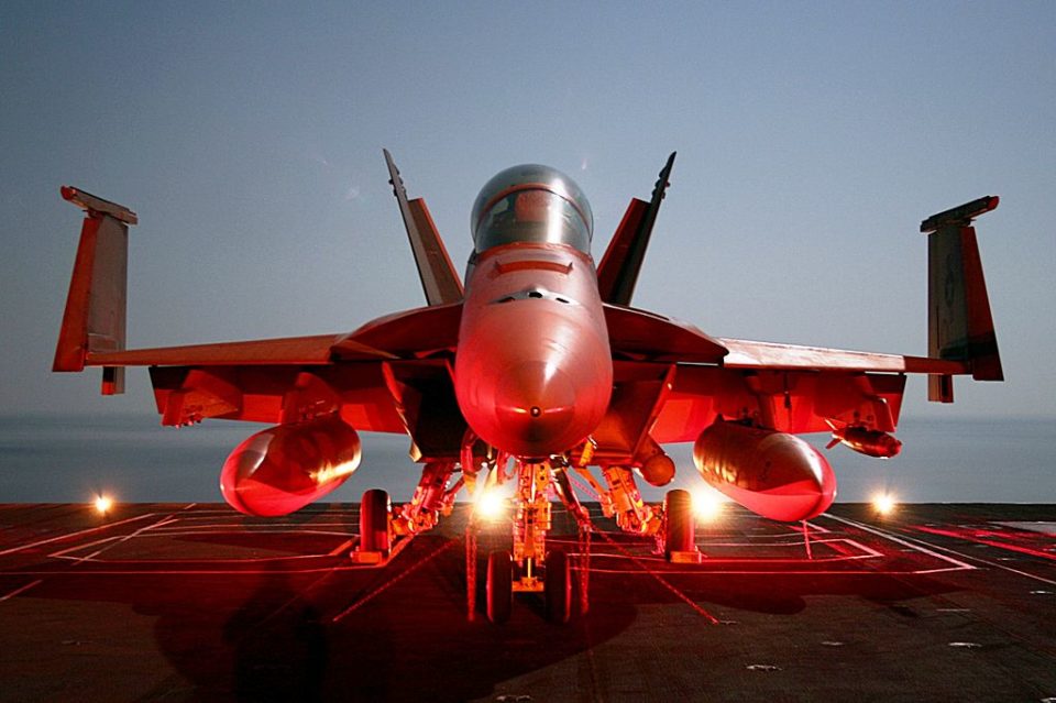 An F/A-18F parked on the flight deck of aircraft carrier Dwight D. Eisenhower, as the ship operates in the Arabian Sea, December 2006