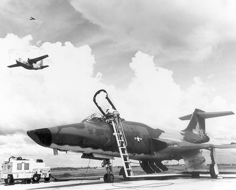 U.S. Air Force technicians prepare a McDonnell RF-101 Voodoo for a photo reconnaissance mission