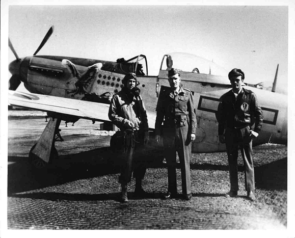 Glenn Eagleston (left side of board)and his very recognizable P- 51D with the "FEEBLE EAGLE" noseart