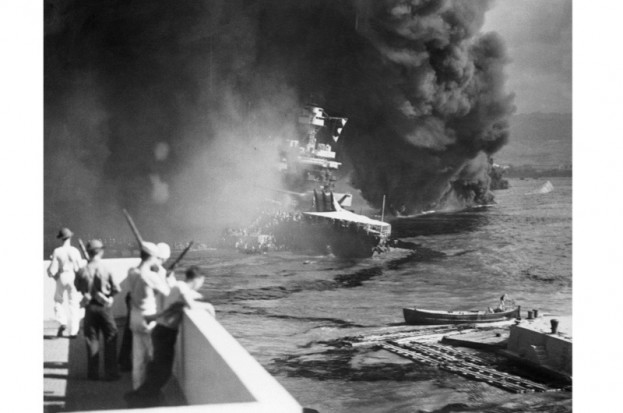 The battleship USS California (centre) following the attack at Pearl Harbor, 7th December 1941.